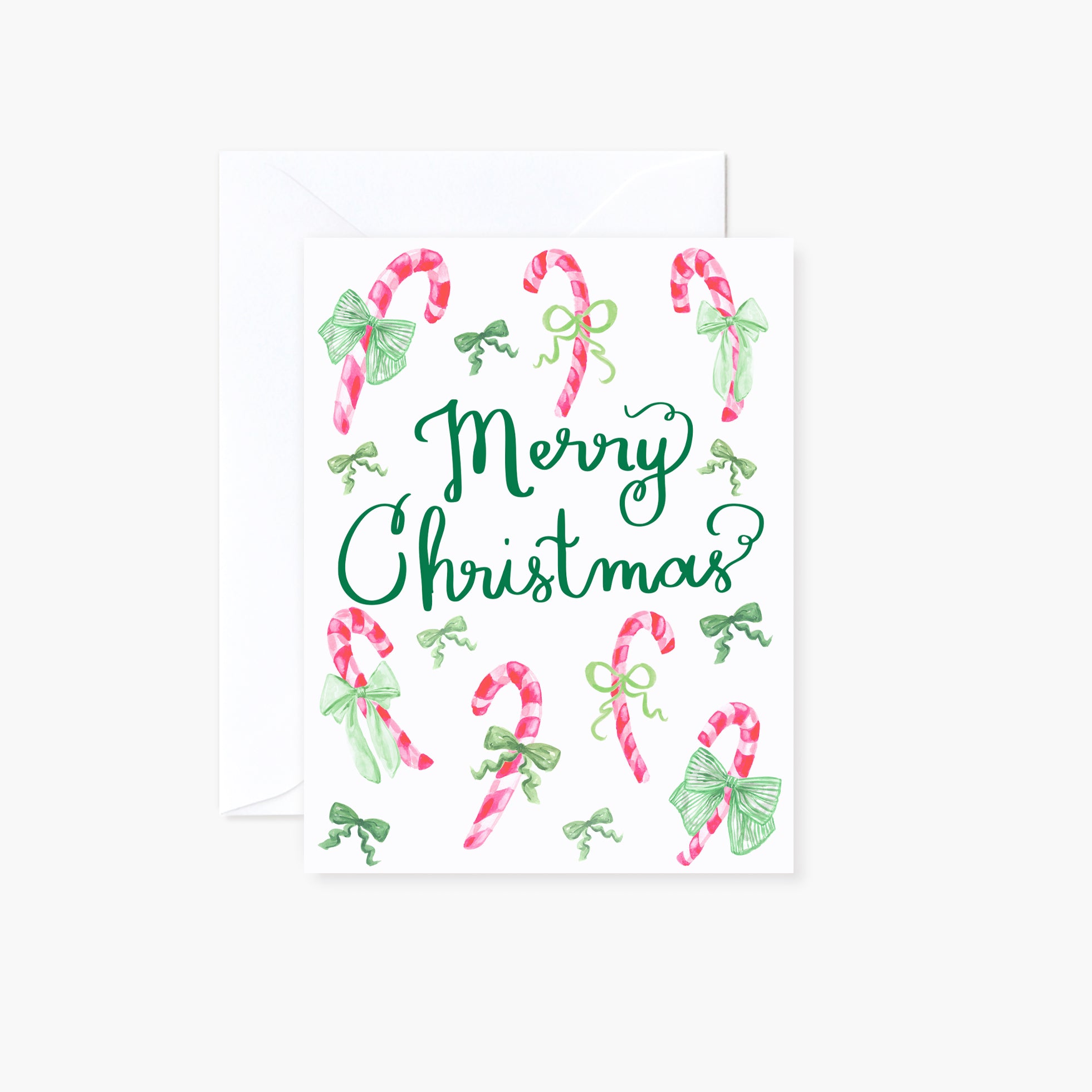 A watercolor illustrated folder Christmas card of pink candy canes wrapped in green bows with hand-lettering "Merry Christmas" in the middle. A white envelope is included.