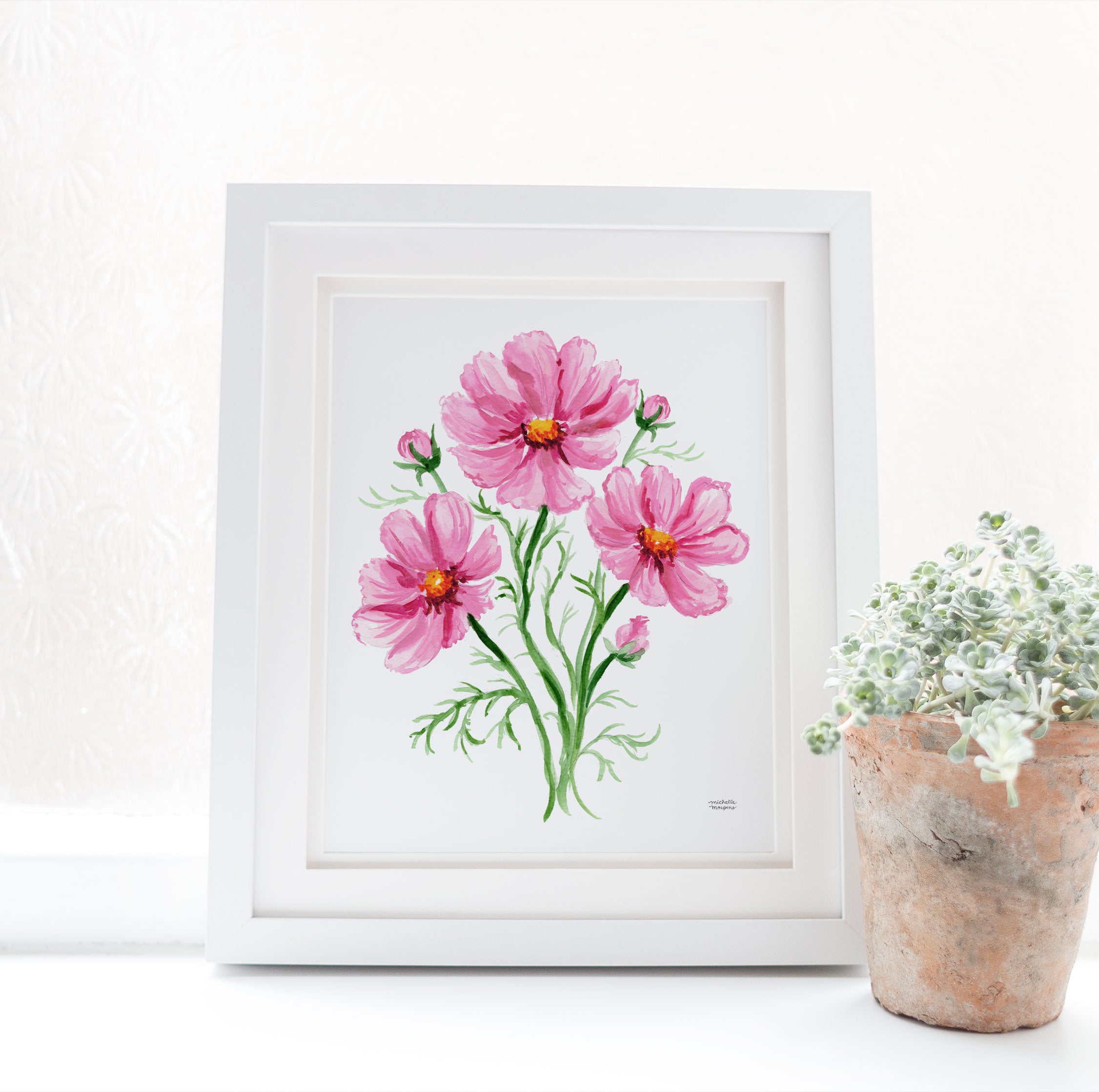 This pink cosmos botanical art print depicts an artful posy of blooms in Michelle Mospens' signature watercolor style. A charming illustrated floral wall art that brings a burst of cheer and romance to your home. Display this floral watercolor artwork on its own or artfully mixed amongst other whimsical art. Perfect for gardeners or the floral-loving host.